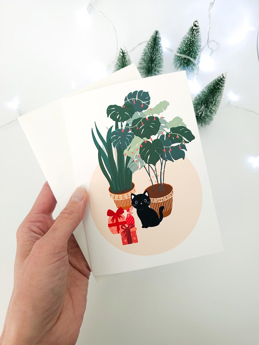 Carte de souhait de Noël, illustration "Chat noir et plantes"